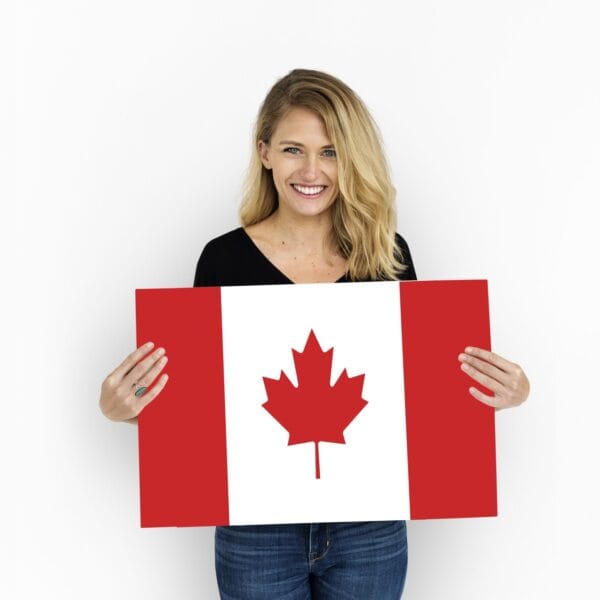 Woman holding a Canada flag for study permits