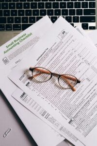 Accounting documents and eyeglasses on a desk