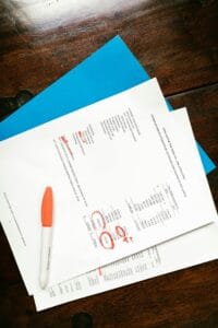Financial documents on a wooden surface