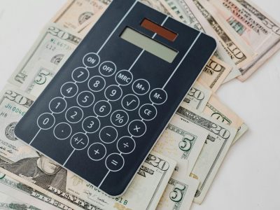 Calculator on money and papers